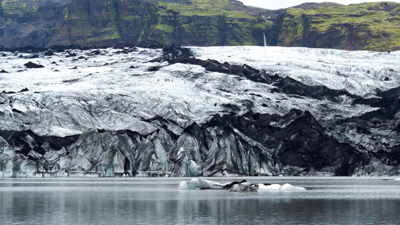 A glacier surrounded by water